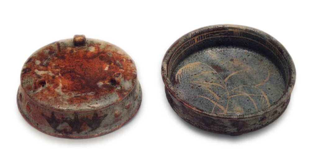 Gray shino mukōzuke bowl with row of bosses, with miscanthus design