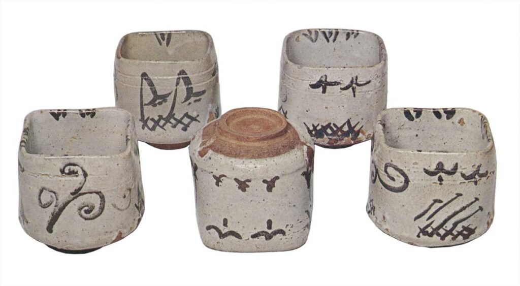 Five mukōzuke bowls with flowering grass designs, E-garatsu type