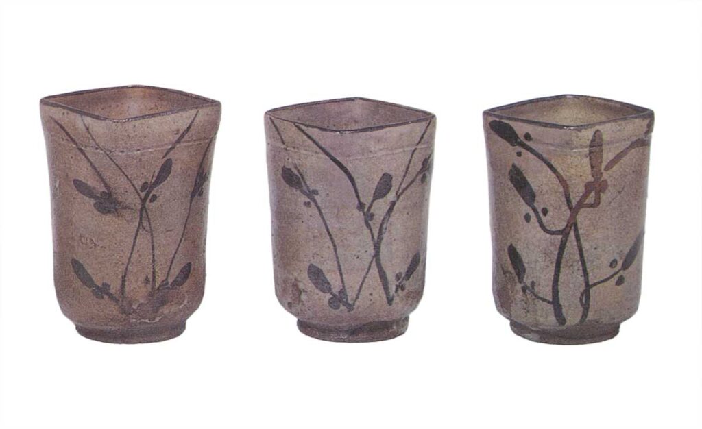 Five cylindrical square mukōzuke bowls with flowering grass designs, E-garatsu type