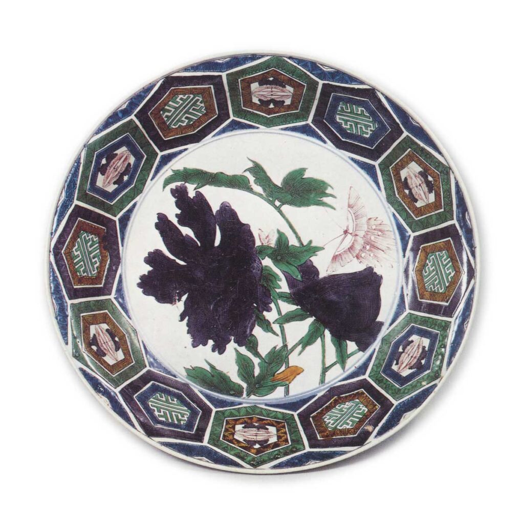 Large bowl with design of peonies and butterfly surrounded by linked hexagons, enamelled ware