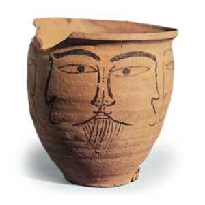 Haji ware: jar with ink drawing of human face.