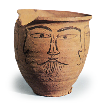 Haji ware: jar with ink drawing of human face.