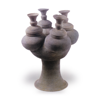 Sue ware: four clustered jars on tall foot.