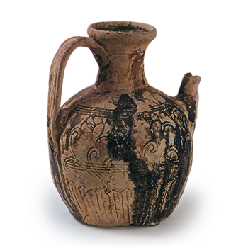 Seto ware: ewre with handle with stamped ornament, iron glaze.