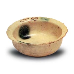 Yellow Seto flower-shaped bowl with chrysanthemum and iris design