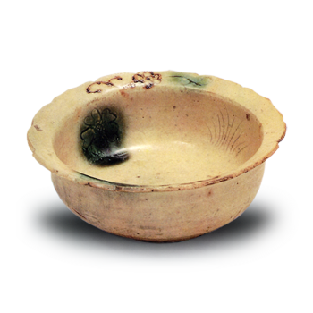 Yellow Seto flower-shaped bowl with chrysanthemum and iris design