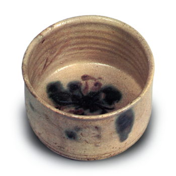 Yellow Seto tea bowl with plum blossom design