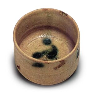 Yellow Seto tea bowl with dōhimo band, with plum blossom design