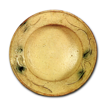 Yellow Seto bowl with clove-flower scroll design