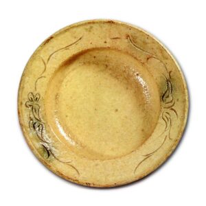 Yellow Seto bowl with clove-flower scroll design