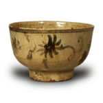 É (with painted ornament) Seto tea bowl with scrolling chrysanthemum design