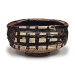 Black Oribe "shoe"-shaped tea bowl with checker patterns, known as "Yabure-mado"