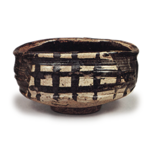 Black Oribe "shoe"-shaped tea bowl with checker patterns, known as "Yabure-mado"