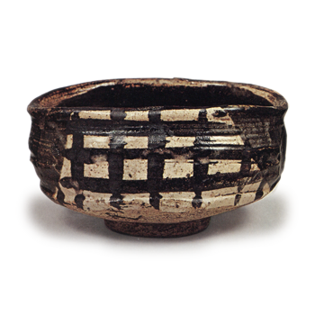 Black Oribe "shoe"-shaped tea bowl with checker patterns, known as "Yabure-mado"