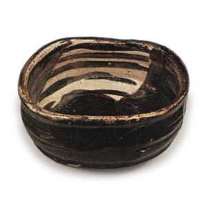 Black Oribe "shoe"-shaped tea bowl with checker patterns, known as "Yabure-mado"