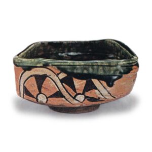 Oribe "shoe"-saped tea bowl with design of katawa-guruma (wheels in stream), known as "Yamaji"