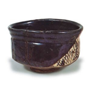 Black Oribe "shoe"-shaped tea bowl with geometric pattern known as higaki