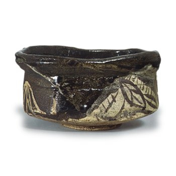 Black Oribe "shoe"-shaped tea bowl with leaf design