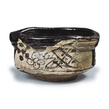 Black Oribe "shoe"-shaped tea bowl with plum blossom design