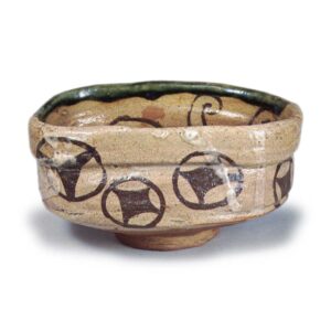 Oribe "shoe"-shaped tea bowl with shippō (interlocking circles) design