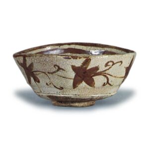 Oribe "shoe"-shaped tea bowl with flowering grass scroll design