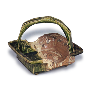 Oribe square bowl of indented sides with handle across mouth with design of reeds and herons