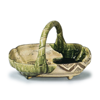 Oribe bowl in shape of boat with handle across mouth