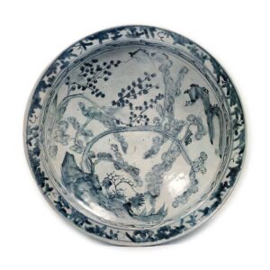 Large bowl with design of landscape, pine and plum trees, blue and white