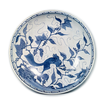 Large bowl with grape and squirrel design, blue and white