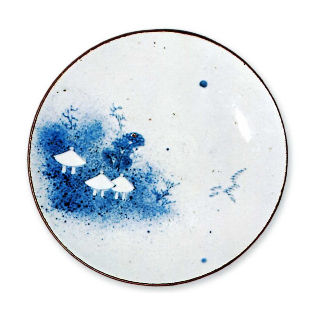 Dish with design of houses against "blown ink",