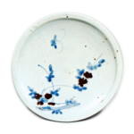 Dish with flowering grass and butterfly design,