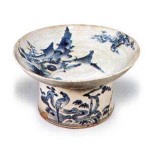 Bowl on foot with landscape and bird design,