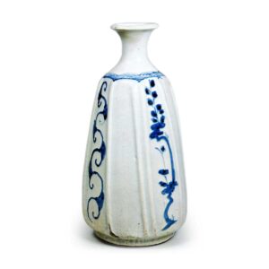 Wine bottle with plum and scrolling plant design,