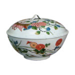 Covered bowl with design of boundle of flowers. enamelled ware