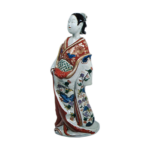 Figure of woman, enamelled ware