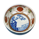 Bowl with red roundel design on inside, dark blue glaze on outside, enamelled ware