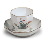 Cup and saucer with autumn grass design, enamelled ware