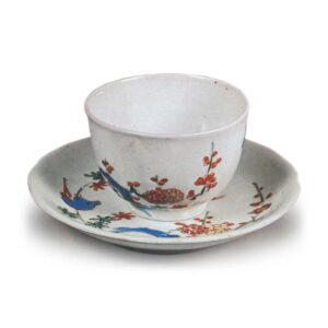 Cup and saucer with Cup and saucer with plum and uguisu (bush wabler) design, enamelled ware