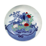 Dish with design of flower pot with peonies and treesaround rocks. enamelled ware