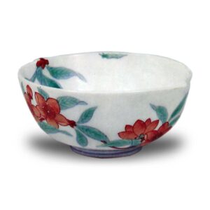 Cup with peach blossom design. enamelled ware