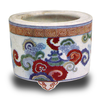 Incense burner with cloud and towered pavilion design. enamelled ware