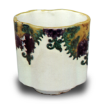 Wine cup with floral scroll design. undergiaze blue. overglaze enamels