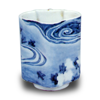 Wine cup with design of maple leaves afloat on water stream. blue