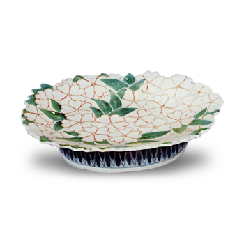 Dishes with cherry blossom design. undergiaze blue. overglaze enamels