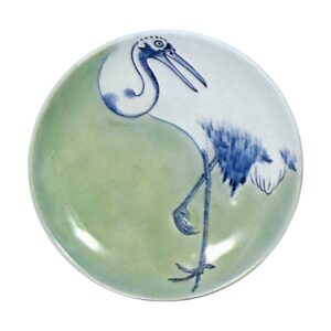 Dishes with crane design. celadon glaze. and blue and white