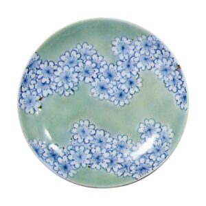 Dishes with design of bands of cherry blossoms.celadon glaze. and blue and white on reserved area
