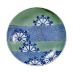 Dish with design of water mills and seigaiha (conventionalized overlap ping waves). blue and white. partial celadon giaze on reserved area