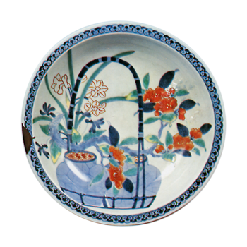 Disn with design of camellias in pots, undergiaze blue, overgiaze enamels