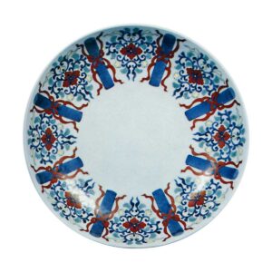 Dish with handroli design. undergtaze blue. overglaze enamels