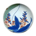 Dish with peach blossom design, underglaze blue. overglaze enamels. and partial celadon glaze